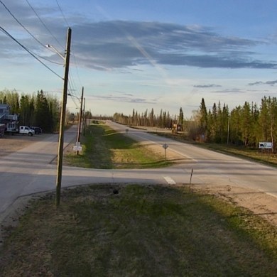 Highway 1 entering Enterprise is seen in a GNWT webcam image on the evening of May 21, 2025.